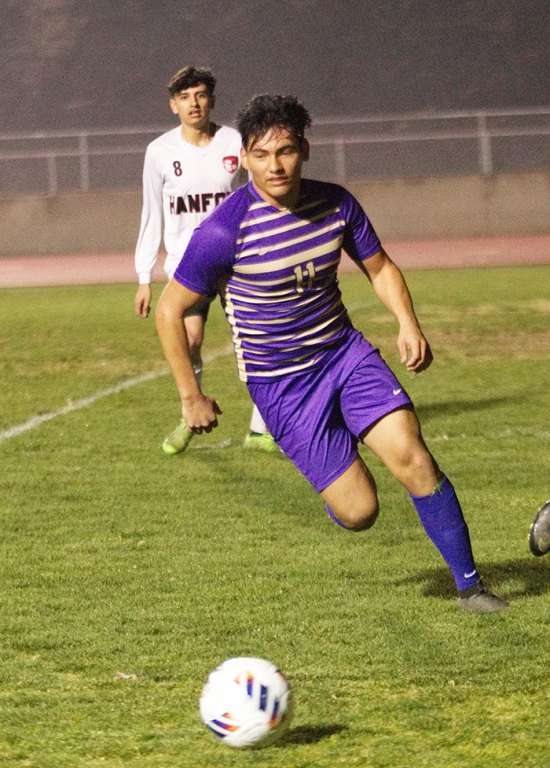 Lemoore's Rosalio Dominquez keeps his eyes on the ball in Thursday's win over Hanford in Tiger Stadium.